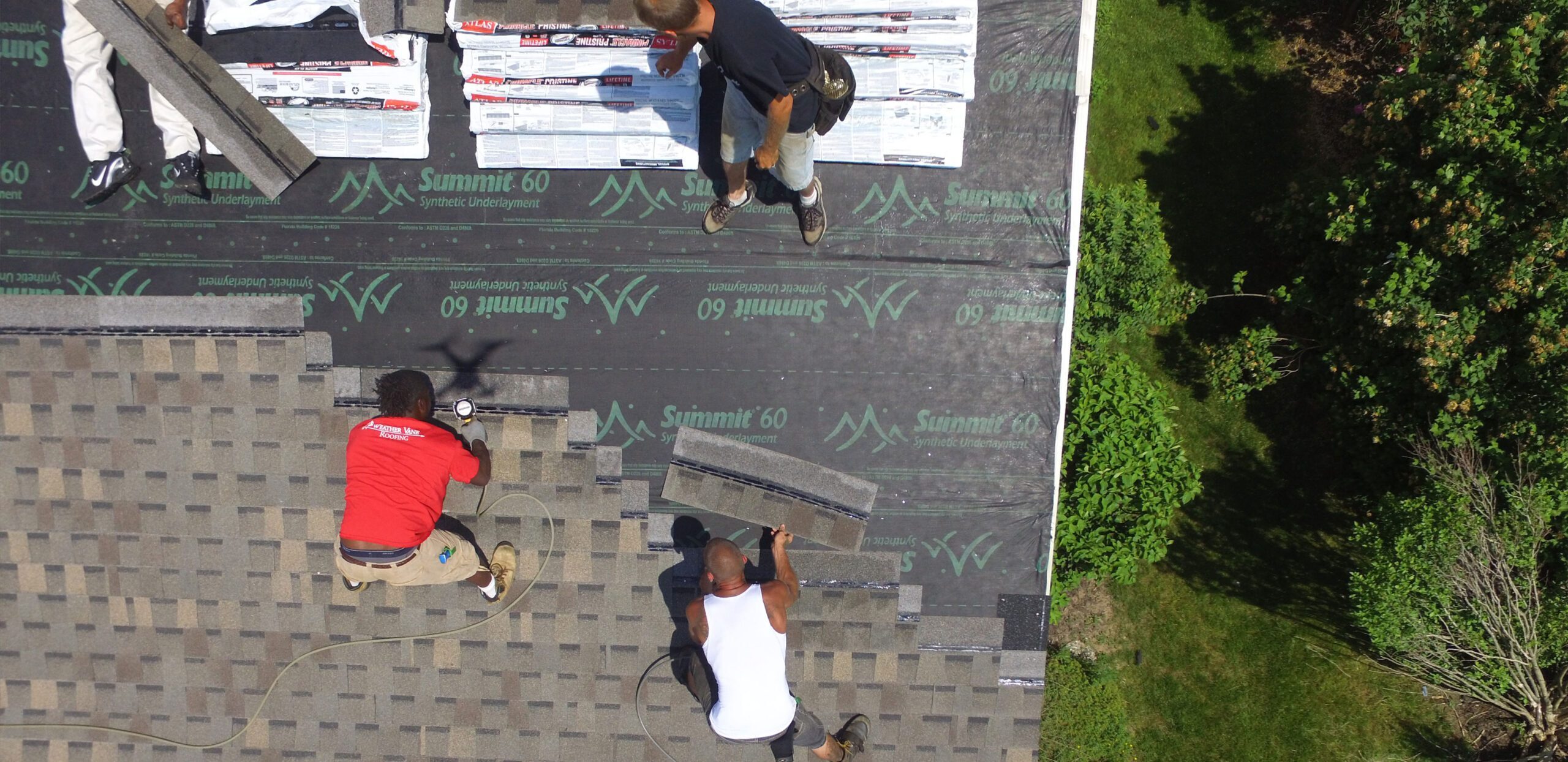 Weather Vane Roofing crew installing shingles